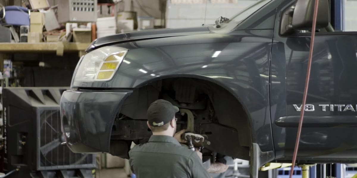 Mechanic working on a truck in a local auto shop